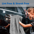 Person cleaning a car window with a towel, with text 'Lint Free & Streak Free' above.