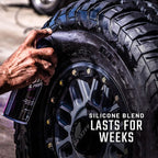 Person applying a silicone blend product to a tire with text 'Silicone Blend Lasts for Weeks'.