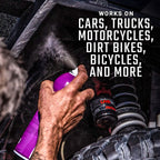 Person using a spray can on a vehicle suspension system with text about product compatibility.