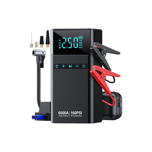 Black jump starter with digital display and clamps on a green background