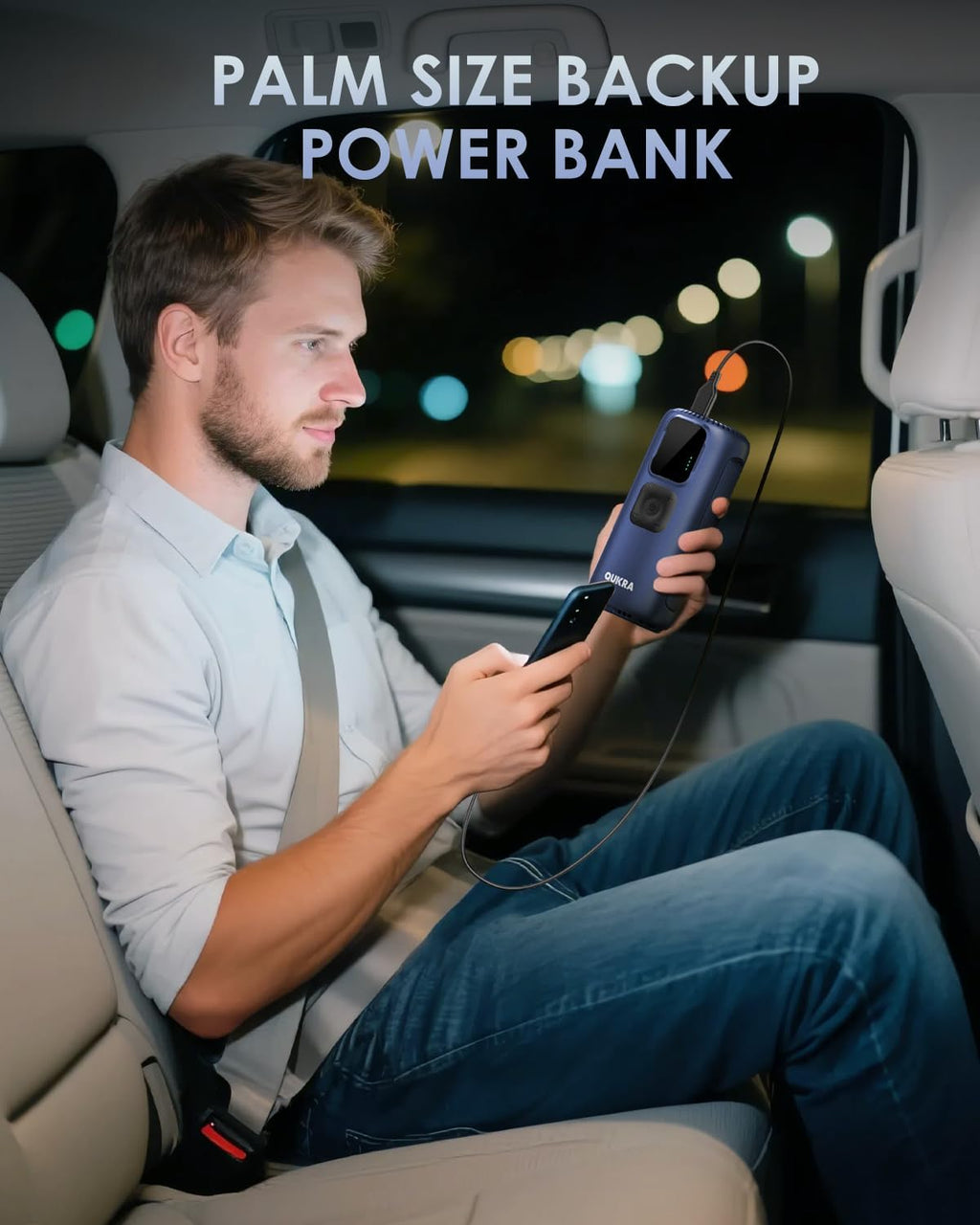 Man using a palm-size backup power bank in a car at night.
